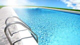 Pool metal railing grassy area - a metal free wallpaper