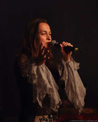 Woman dress microphone singing black - a woman in a dress holding free wallpaper for mobile