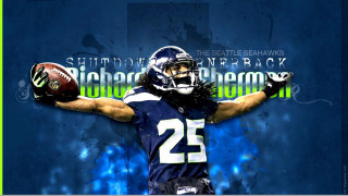 Football player holding football seattle - a football free wallpaper