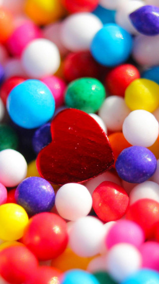 Candy closeup filled heart shaped - free hearts wallpaper for mobile