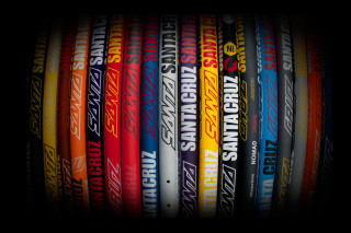 Colored baseball bats black background - a row free wallpaper for desktop