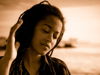 Woman dreadlocks boat portrait blurry - a boat in the background free wallpaper