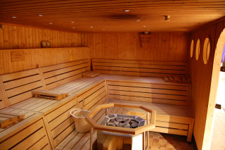 Sauna room table bench bucket - warm lighting free wallpaper