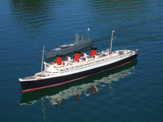 Large boat red sails flag - a tilt shift photo free wallpaper