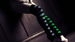 Woman striped stockings green black - op art free wallpaper