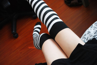 Woman black white striped socks - free halloween wallpaper