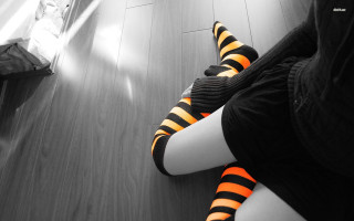 Person striped socks sitting floor - high contrast free wallpaper for desktop