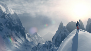 Person standing snow covered mountain - a sky background and sun free wallpaper