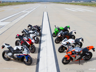 Motorcycles parked runway sky background - cornelisz hendriksz vroom free wallpaper