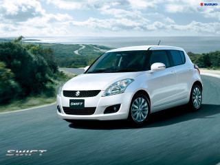 White suzuki swift driving ocean - a cloudy sky free wallpaper
