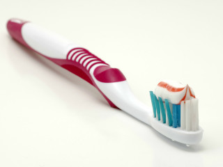 Toothbrush toothpaste tabletop next to - a toothbrush free wallpaper