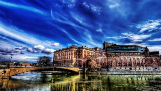Bridge river building cloudy sky - a bridge in the foreground free wallpaper