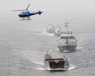 Helicopter flying fleet ships ocean - a helicopter free wallpaper