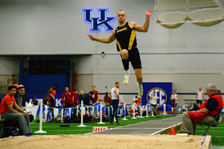 Man jumping track crowd stadium - a crowd free wallpaper