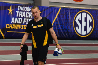 Man holding water bottle walking - ben zoeller free wallpaper