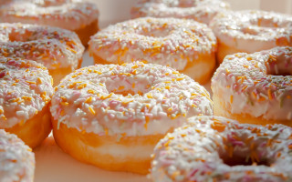 Glazed donuts sprinkles bite taken - sprinkle free wallpaper