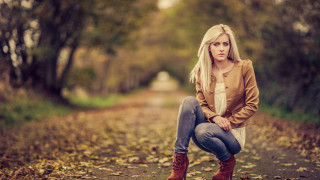 Woman sitting tree stump forest - the ground and trees free wallpaper