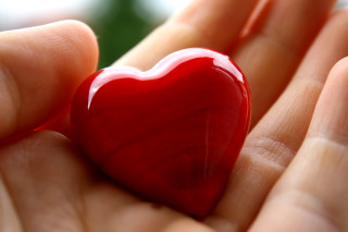 Heart shaped object hand blurry - object free wallpaper