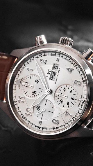 Close up watch black surface - a black surface free wallpaper for mobile