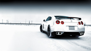 White sports car snowy road 4 - a white sports car free wallpaper