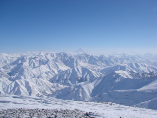 Snowy mountain range high altitude - a clear blue sky free wallpaper