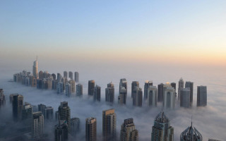 Foggy city skyscrapers clouds background - skyscraper free wallpaper