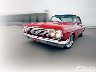 Red car driving street building 5 - photoreal free wallpaper
