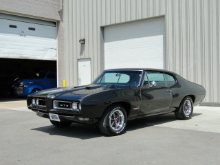 Black muscle car garage blue - a garage door open free wallpaper