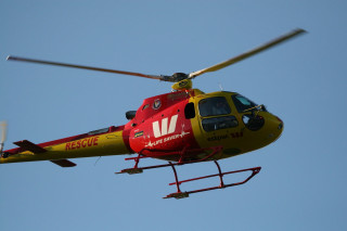 Red yellow helicopter blue sky 2 - a propeller free wallpaper
