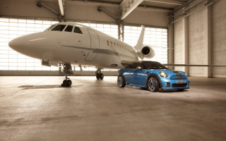 Small blue car airplane hangar - luxury free wallpaper