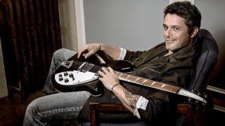 Man chair guitar smiling camera - a chair holding free wallpaper