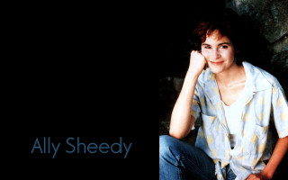 Woman sitting rock hand black - anne rigney free wallpaper