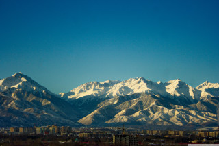 Mountain range city clear sky - a clear blue sky above free wallpaper