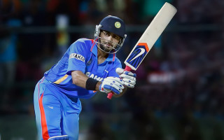 Man blue uniform holding bat - a blue uniform holding free wallpaper