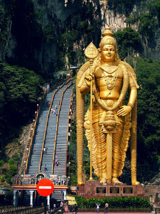 Golden statue god mountain stairs - large free wallpaper