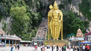 Golden statue man temple mountain - a staircase free wallpaper