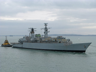 Large ship tug boat smaller - nearby free wallpaper