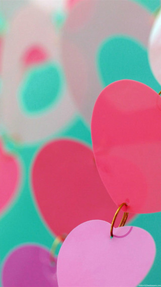 Heart shaped object hanging string - a string free wallpaper for mobile