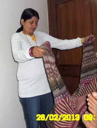 Woman holding cloth smiling woman - a cross stitch free wallpaper for mobile