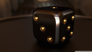 Black dice gold dots table - a blurry background of a building free wallpaper