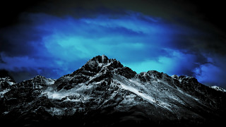 Mountain range dark sky clouds - a dark sky in the background free wallpaper