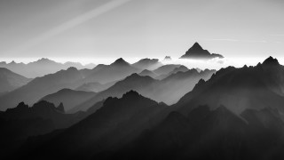 Black white mountains sky sunbeam - volumetric fog free wallpaper