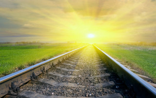 Train track sunshine horizon grass - a train track free wallpaper for desktop