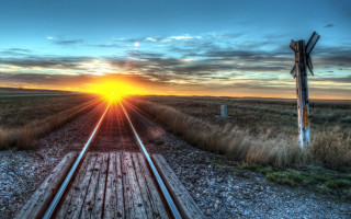 Train track sunset signpost distance 3 - the side of the track free wallpaper