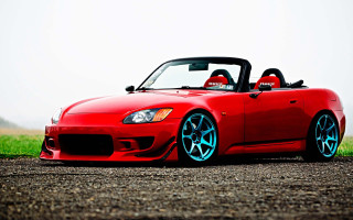 Red sports car gravel road - rim free wallpaper