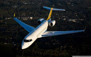 White yellow airplane flying city - digital free wallpaper for desktop