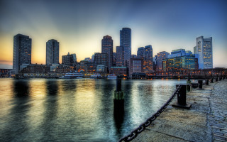 City skyline water fence view - a large body of water in front free wallpaper