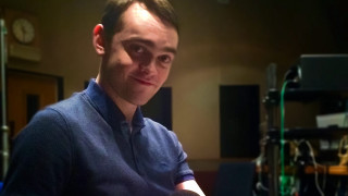 Man blue shirt remote control - studio photo free wallpaper