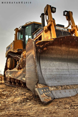 Bulldozer parked dirt field sky - precisionism free wallpaper