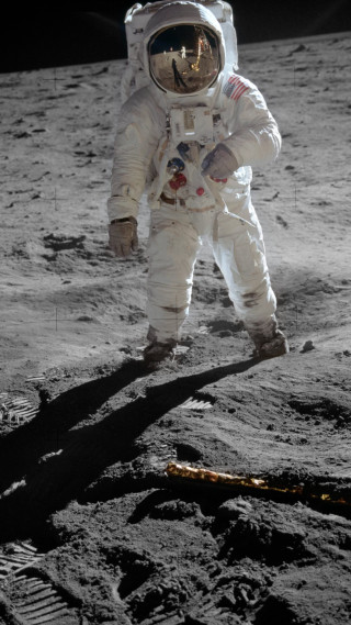 Astronaut moon walking shadow ground - free space wallpaper for mobile